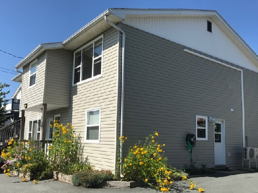 Exterior of a two-storey home with vinyl siding